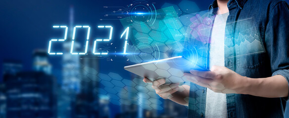 2021 New year smart Asian business man using mobile phone tablet data analyze digital technology smart city simulation, futuristic artificial intelligence tech digital security computer engineering. 