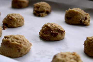 ball of cookie dough in baking sheet