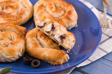 Pastry swirls with cheese and olive filling.
