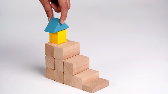 Business growth, building success, ladder career path foundation concept, Hand arranging wooden block stacking as step stair. Copy space.