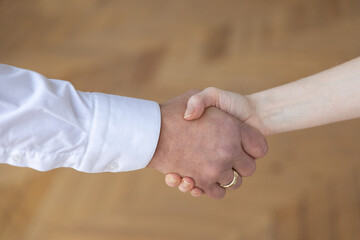 male and female firm handshake