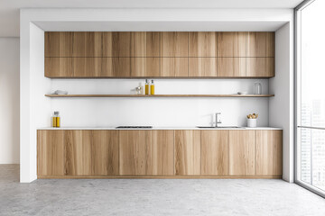White and wooden minimalist kitchen set with shelves near window