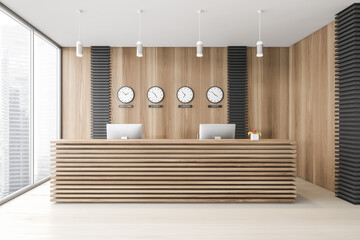 Wooden office waiting room with reception and clocks
