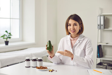 Professional dietitian telling about benefits of healthy diet with food supplements