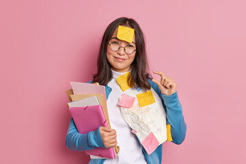 Glad brunette schoolgirl makes tiny gesture tells she needs little more time for exam preparation...