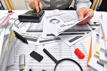 business concept - businessman working with reports in office, table and workspace close view,...