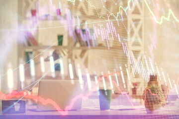 Double exposure of stock market graph drawing and office interior background. Concept of financial analysis.