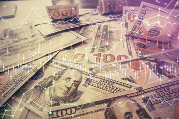 Multi exposure of forex chart drawing over us dollars bill background. Concept of financial success markets.