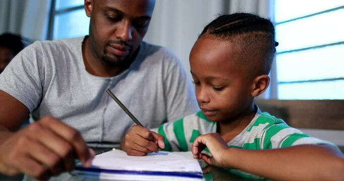 Father mentoring son, dad helping kid with homework study