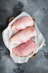 Chicken raw fillet on grey background, top view