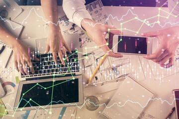 Multi exposure of man and woman working together and forex graph hologram drawing. Financial analysis concept. Computer background. Top View.