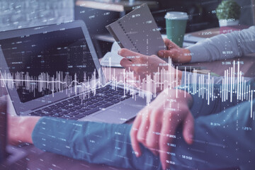 Double exposure of man and woman working together and forex chart hologram. Business concept. Computer background.