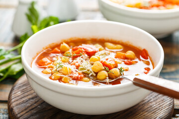 Vegetables soup bowl. Tuscan tomato chickpea soup with various vegetables, thyme and parmesan...
