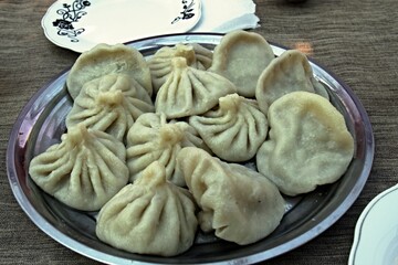 Chinkali is a Georgian national dish. Thistle dumplings filled with a mixture of meat, onions, herbs, coriander. Boil in water and serve with pepper. Georgia