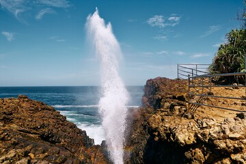Fototapeta na wymiar Water geyser from rock