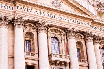 Facade of St. Peter's Basilica in the Vatican close-up. Pope's balcony. 
