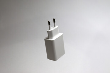 charger and usb cable for phone on white background