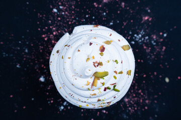 A popular French meringue dessert on a black background. Closeup.