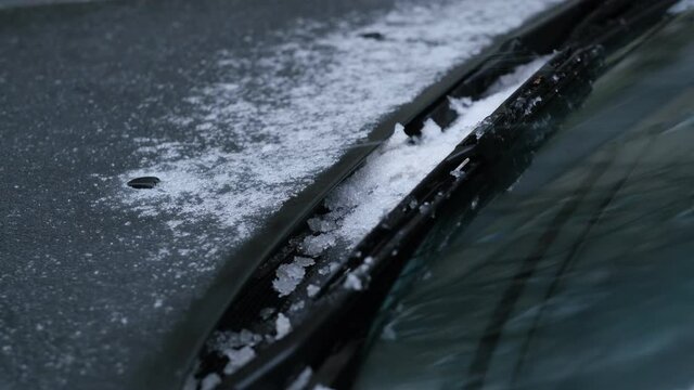 car wipers clean the windshield from snow and rain