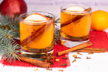 Christmas mulled wine with apples and citrus fruits and spices.
Close-up.Christmas drinks concept.