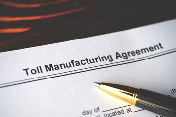 Legal document Toll Manufacturing Agreement on paper close up