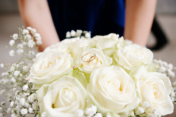 Obraz na płótnie Canvas wedding decoration, flowers on the envelope, boutonnieres, gray background, envelope