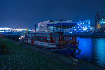 The architecture of the city of Bydgoszcz on the Brda River in the Kuyavian-Pomeranian Voivodeship in the evening time.
