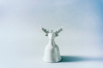 Abstract conceptual winter holiday background with tiled reindeer bell ornament