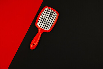 Hairbrush on a simple flat background with place for text, stylish and beautiful design, copy space