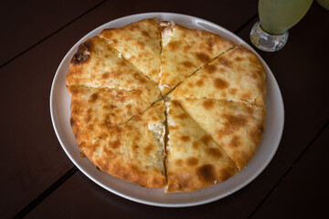 Abkhazian delicious egg and cheese dish on a wooden table