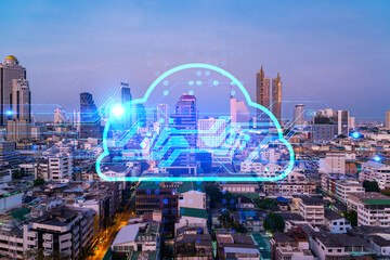 Glowing hologram of cloud icon, aerial panoramic cityscape of Bangkok at sunset. The concept of secure storage of digital data in Asia. Multi exposure.