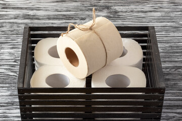 Eco-friendly bamboo toilet paper in black wooden box.
