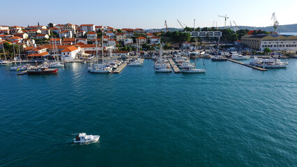 Fototapeta na wymiar Aerial view of Trogir harbor and boat sailing