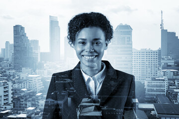 Successful smiling black African American business woman in suit. Bangkok cityscape. The concept of...