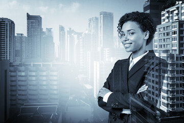Fototapeta premium Smiling black African American business woman in suit in crossed arms pose. Bangkok cityscape. The concept of woman in business. Investment fund. Double exposure.