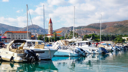 Vew of Trogir town from a harbor with boats and Trogir Cathedral bell tower
