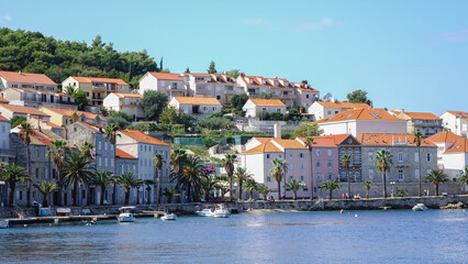 Close-up view of Korcula bay with houses and boats