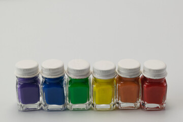 Six glass containers colors of diversity