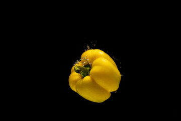 Yellow pepper on black