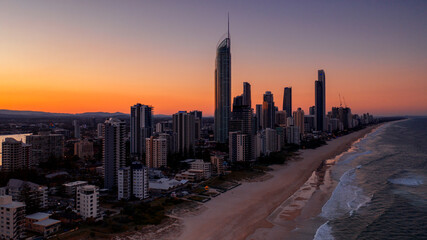 Fototapeta premium Aerial sunset view over Surfers Paradise beach and skyline