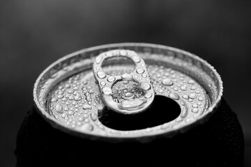 A can of cola with dewdrops in macro b/w