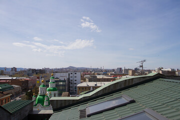 Roof window and city view. The roof of the house