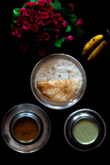 Homemade delicious set dosa in a plate on a dark background