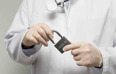 Covid-19 corona virus pandemic isolation lockdown with a doctor and a padlock