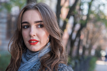 Portrait of a beautiful and happy girl outdoors. Beauty and fashion