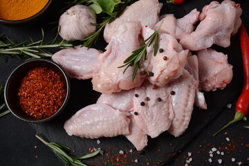 Raw chicken wings with ingredients and spices for cooking