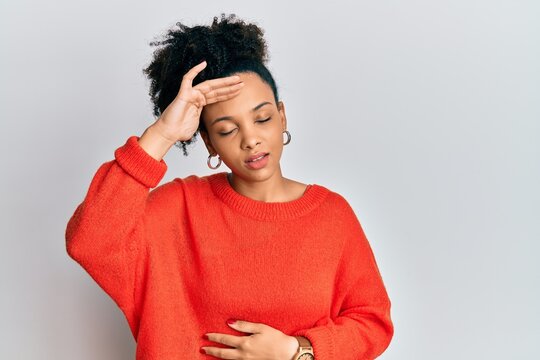 Young african american girl wearing casual clothes touching forehead for illness and fever, flu and cold, virus sick