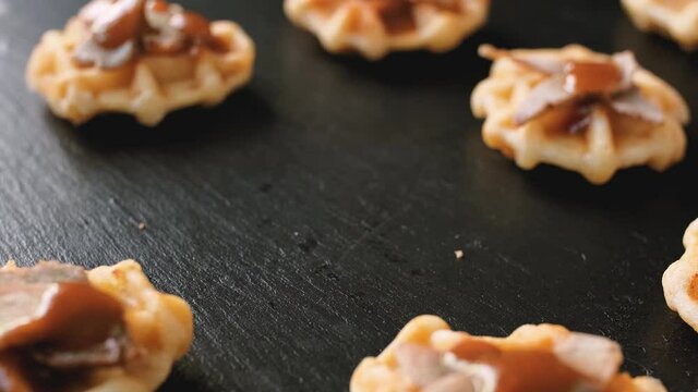 Woman's Hand pick up Mini waffle duck. party food