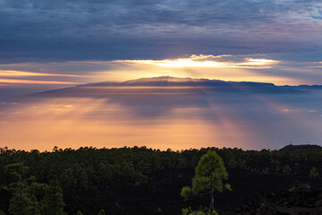 Sunset from El Teide National Park. A cloudy sunset with the sun peaking through it