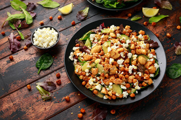 Roasted Cauliflower salad with chickpea, cucumber, greens and feta cheese. healthy food